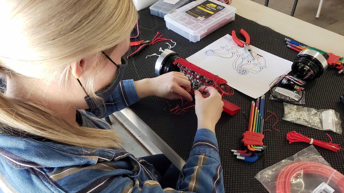 ASU robotics team Desert WAVE prepares for second competition ASU robotics team Project Manager Andrea Schoonover assembling the pneumatics hull.