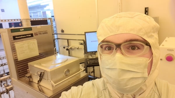 Selfie photo of Carson Gockley dressed in lab gear