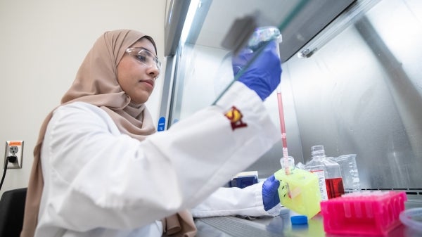 Fathima Nawaz working in lab.