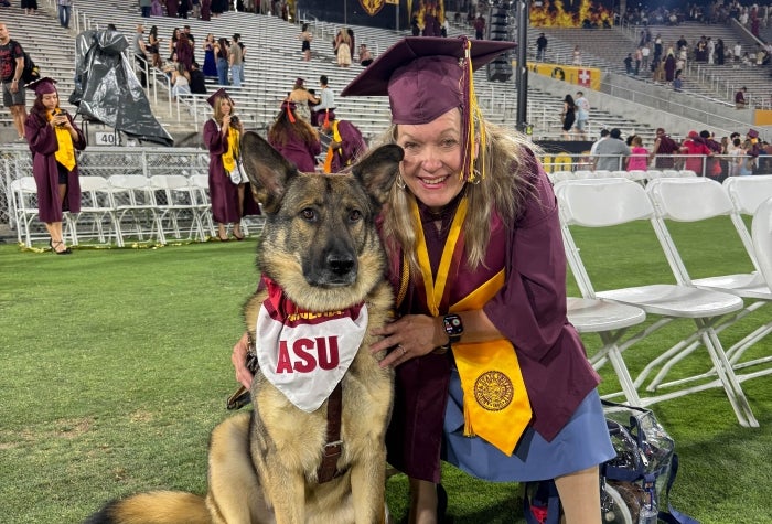 Suzette May and her German shepherd Seeing Eye Dog, Fred, attend Arizona State University’s graduation ceremony. 